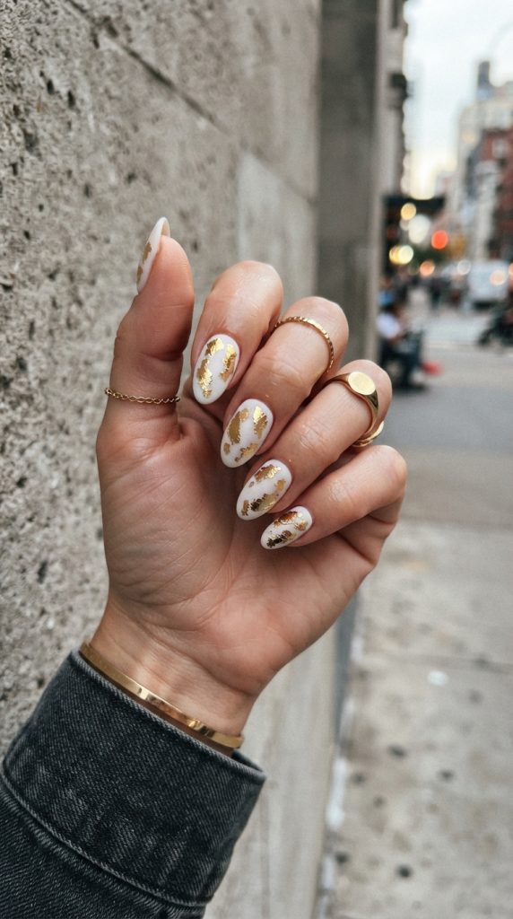 white and golden nails